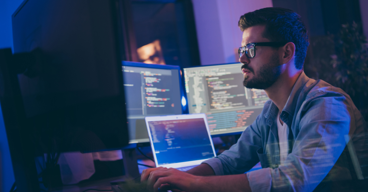 man with tech skills in front of computer