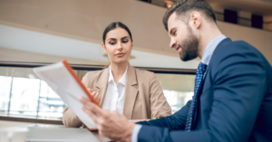 A manager and employee negotiating a pay rise. 