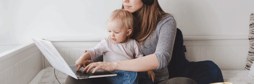 a women and her child on a laptop working from home