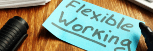flexible working written on a blue piece of paper on a desk