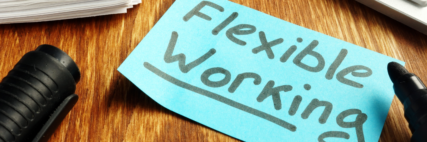 flexible working written on a blue piece of paper on a desk