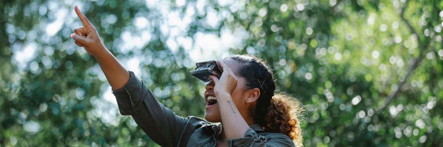 lady looking through binoculars